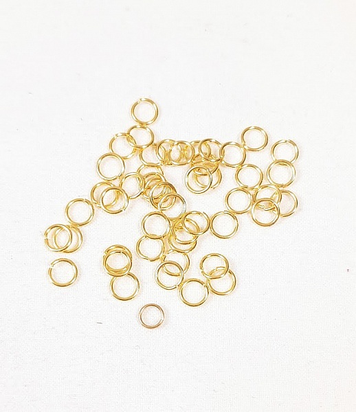 Appr&ecirc;ts bijoux: lot de 100 anneaux de jonction ouverts 5mm dor&eacute;s