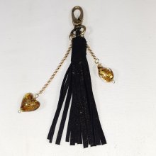 Bijou de sac, pompon cuir coloris noir et or avec coeur verre de Murano.